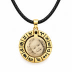 Gold-coloured zodiac pendant with black leather cord and personalized photo engraving