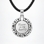 Silver-coloured zodiac pendant with black leather cord and personalized text engraving